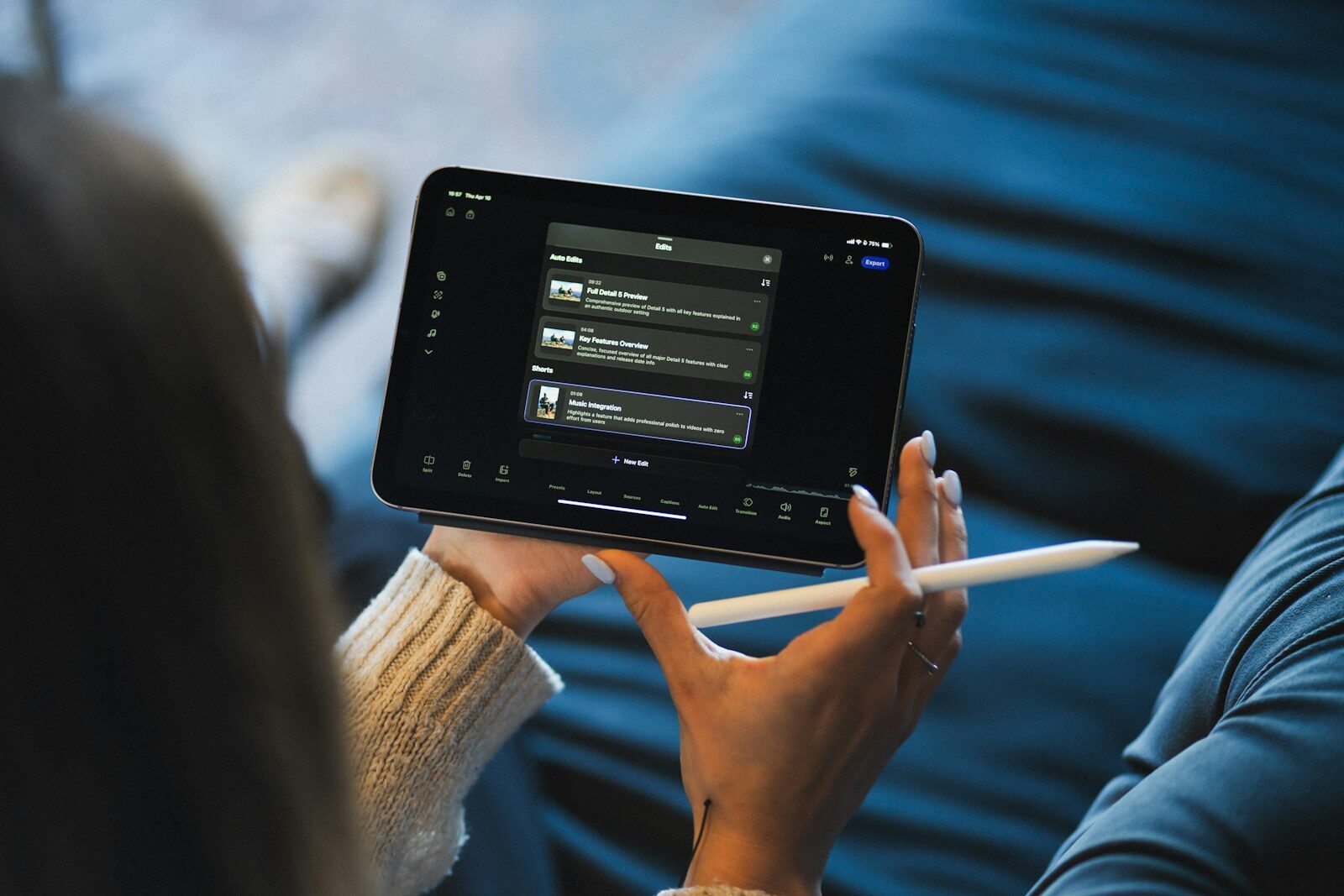 Person holding a tablet and stylus device